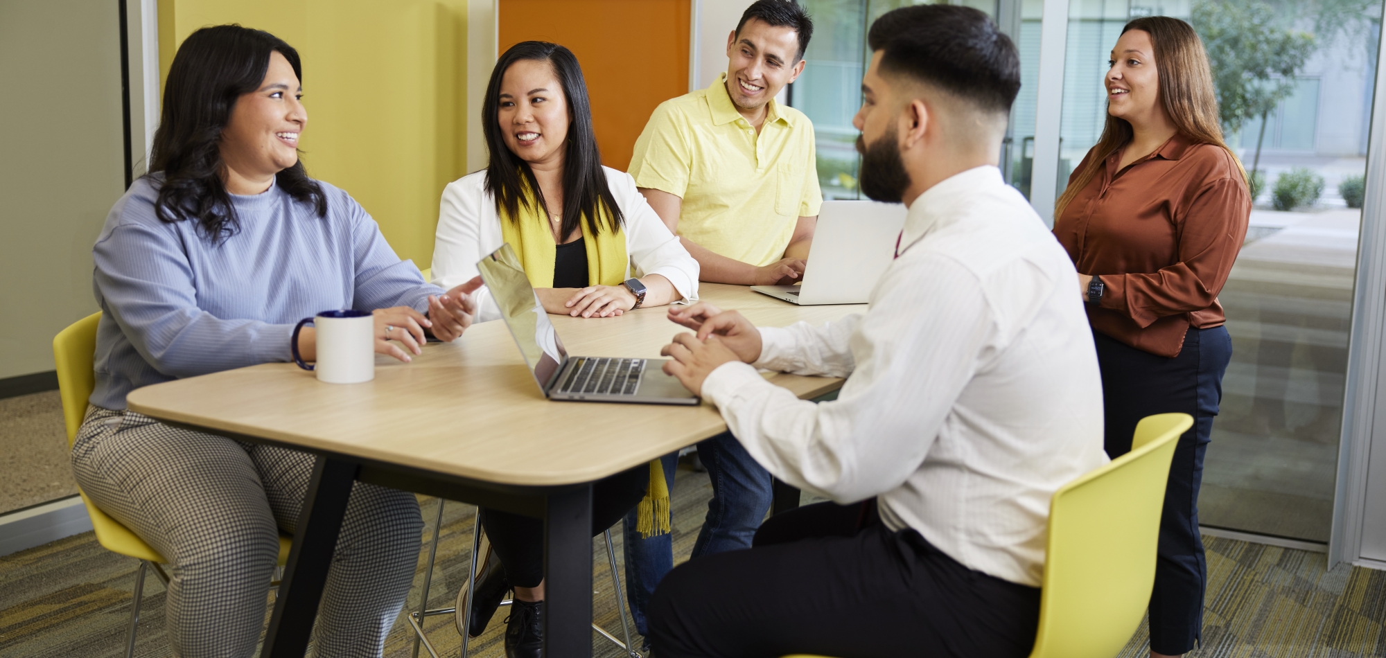 Thunderbird students and partners meet in One Global Place's global community room