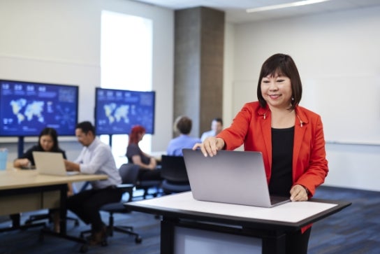 Thunderbird Senior Associate Dean and Professor Lena Booth teaching in a classroom