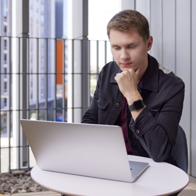 Image of a Thunderbird student using a laptop.