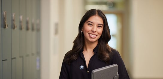 Image of Thunderbird student smiling at the camera